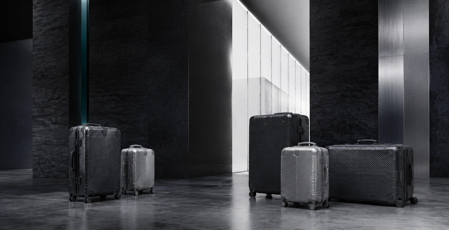 RAVONA luggage collection in a charcoal architectural setting